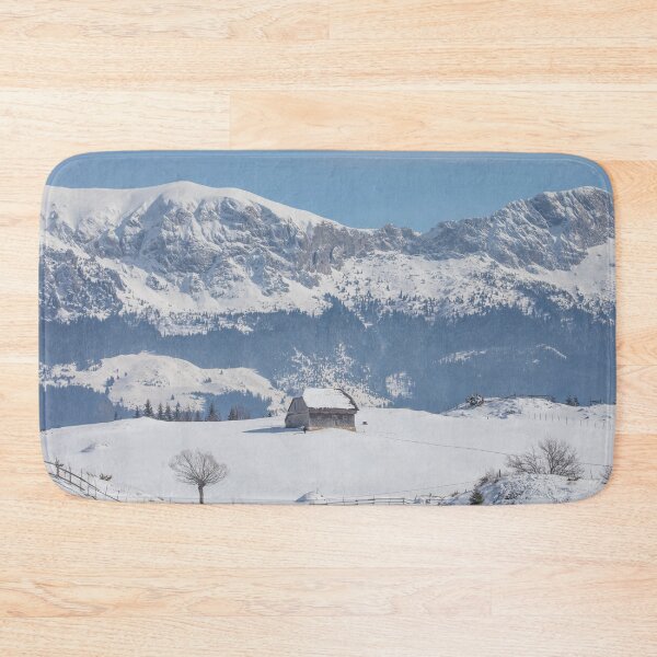Item preview, Winter landscape with an old house and Bucegi mountains in the background designed and sold by sonyc.