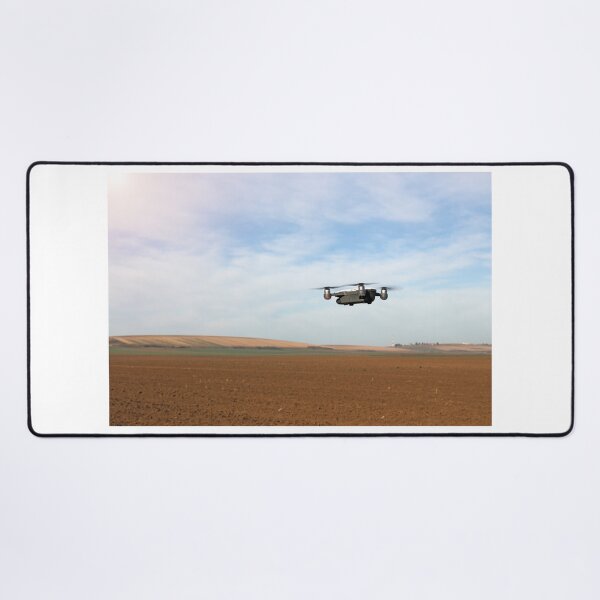 Item preview, The drone is flying over the plowed field in springtime designed and sold by goceris.