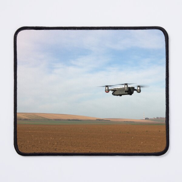 Item preview, The drone is flying over the plowed field in springtime designed and sold by goceris.