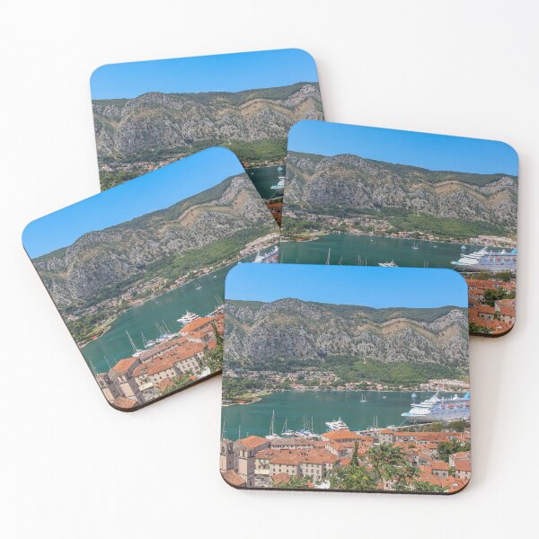 Item preview, A cruise ship moored at the harbour in the old town in Kotor, overlooked by mountains, Montenegro designed and sold by SnapTPhotograph.