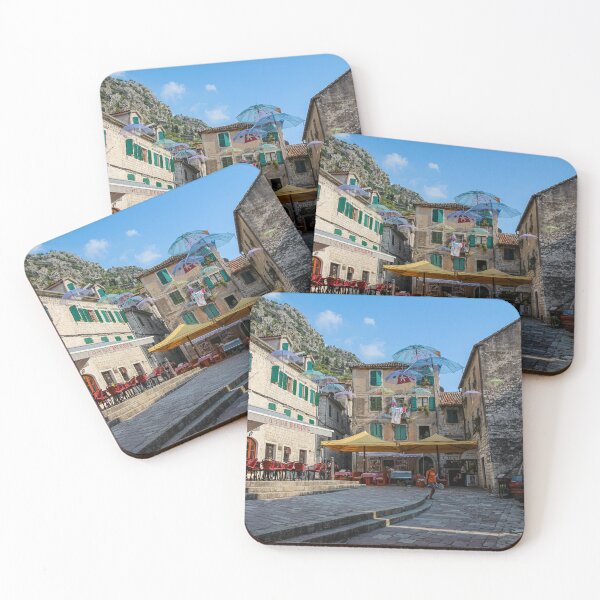 Item preview, Cafe's and flying umbrellas on a square in the old town of Kotor, Montenegro designed and sold by SnapTPhotograph.