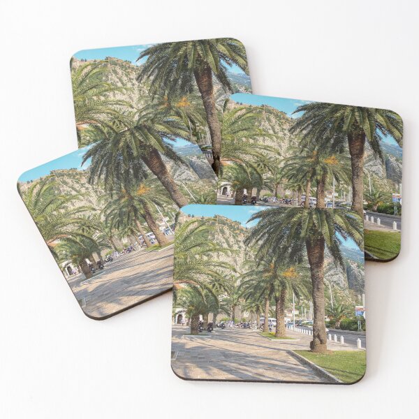 Item preview, Palm tree lined pavement or sidewalk beside the harbour in Kotor, Montenegro designed and sold by SnapTPhotograph.