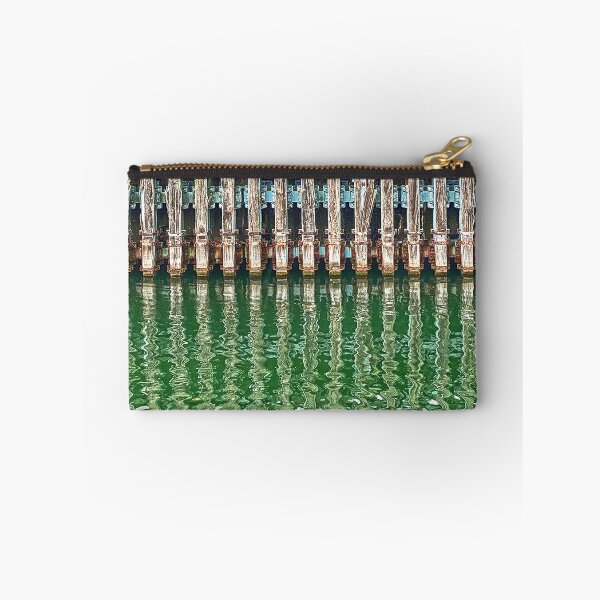 Item preview, Dock pilings reflected in Sassnitz Harbor, Rügen Island, Germany designed and sold by Michael Brewer.