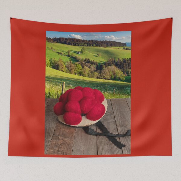 Item preview, Original Black Forest Bollenhut on a wooden table with a view of the landscape designed and sold by Jürgen Wiesler.