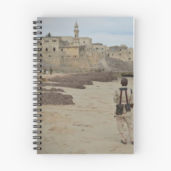 Item preview, A member of the Somali National Army stands guard on a beach near the city of Merca designed and sold by VintageSomalia.