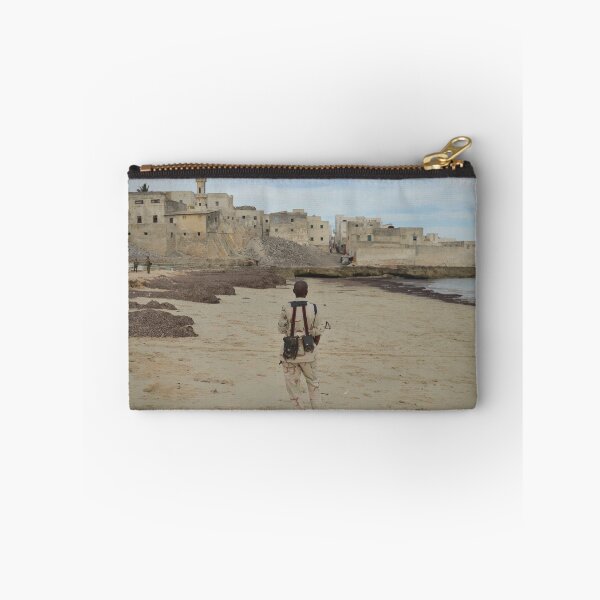 Item preview, A member of the Somali National Army stands guard on a beach near the city of Merca designed and sold by VintageSomalia.
