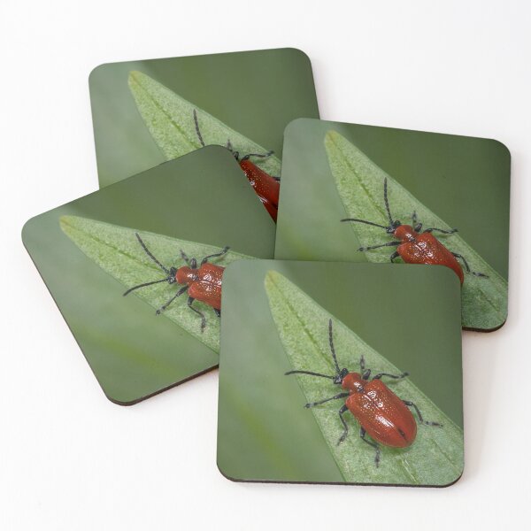 Item preview, Scarlet lily beetle sitting on a green leaf designed and sold by Stefan Rotter.