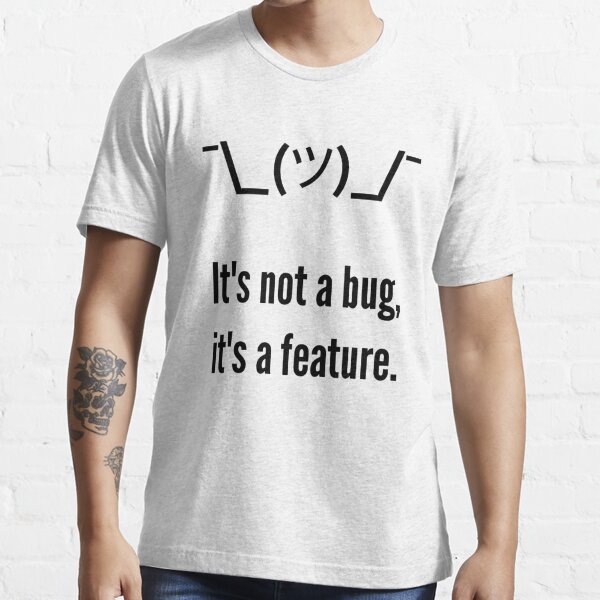 Shrug It's not a bug, it's a feature. Programmer Excuse Black Design Essential T-Shirt