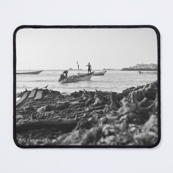 Item preview, Two fishermen prepare their boat for a night of fishing at a port in Bossaso, Puntland designed and sold by VintageSomalia.