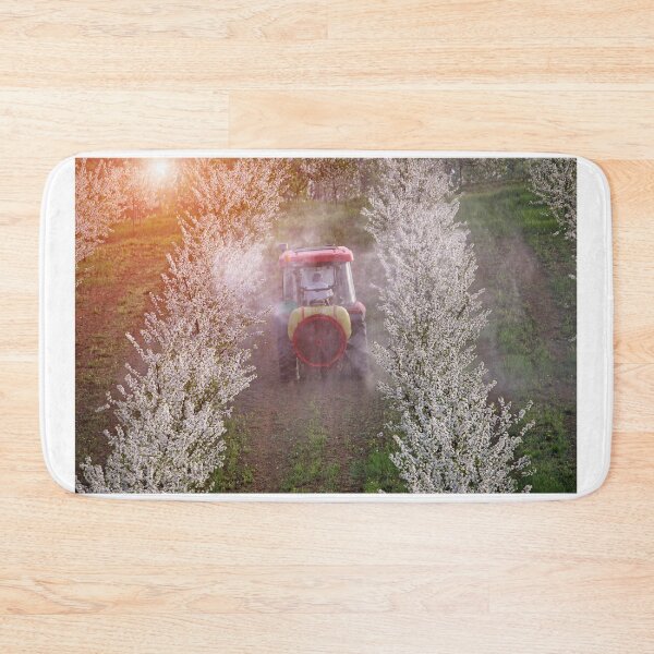 Item preview, tractor sprays insecticide in cherry orchard agriculture springtime designed and sold by goceris.