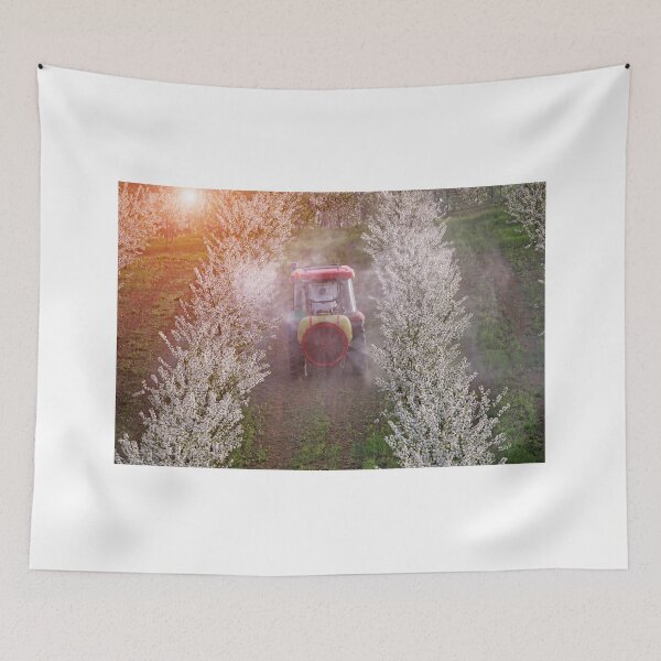 Item preview, tractor sprays insecticide in cherry orchard agriculture springtime designed and sold by goceris.