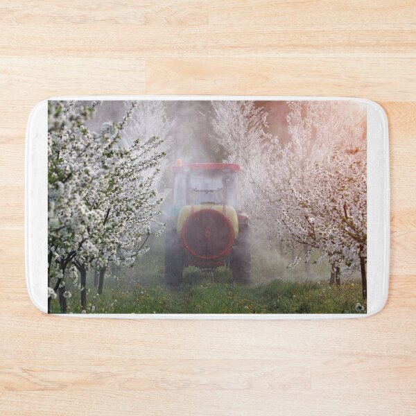 Item preview, tractor sprays insecticide in orchard agriculture springtime designed and sold by goceris.