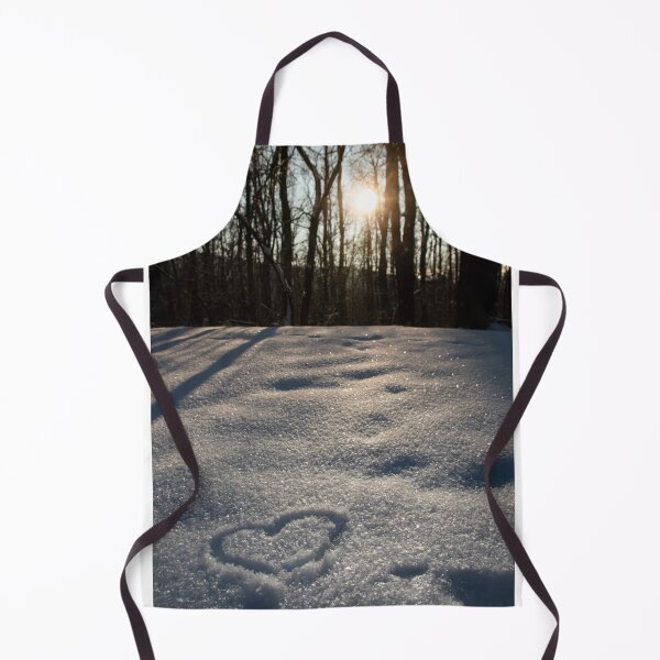 Item preview, Heart shape with finger in white shiny snow. Sunset sun is shining through the trees. Cold winter day. Animal footsteps. Love is in the air. designed and sold by BumbleVee ☀️.