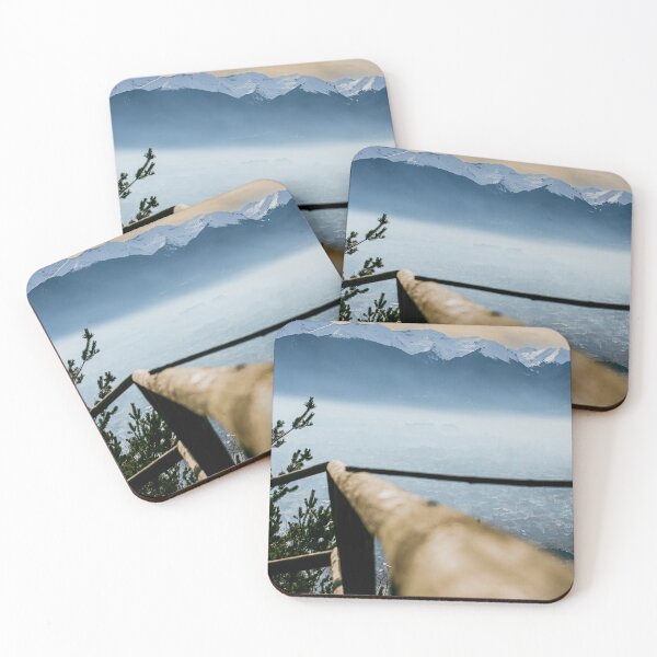 Item preview, Wooden rail on sunset with snowy mountains in distance background. Beautiful stunning nature shot. City of Razlog, underneath the mountains. designed and sold by BumbleVee ☀️.