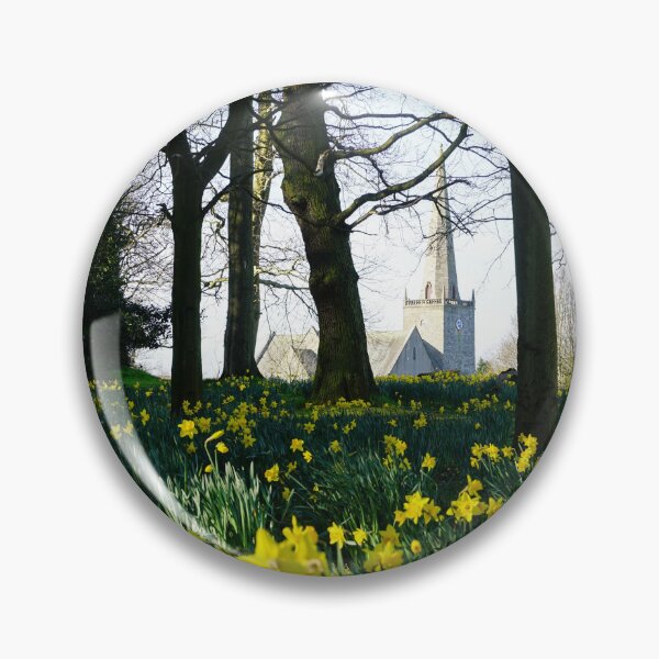 Item preview, Park full of daffodils and stone church in the background designed and sold by NavorolArt.