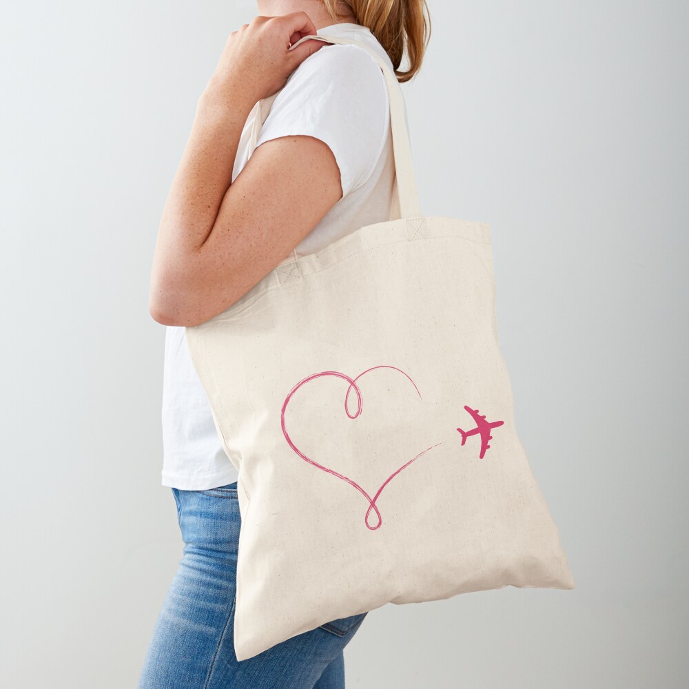 Heart shaped icon in air, made by plane Tote Bag for Sale by pixxart