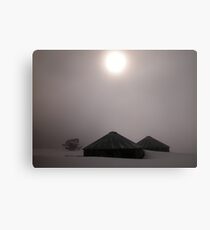 Shrouded Sun over Snowbound Water Tanks Canvas Print