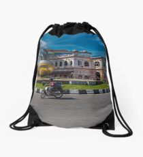 Little bike and a Big Sculpture Drawstring Bag