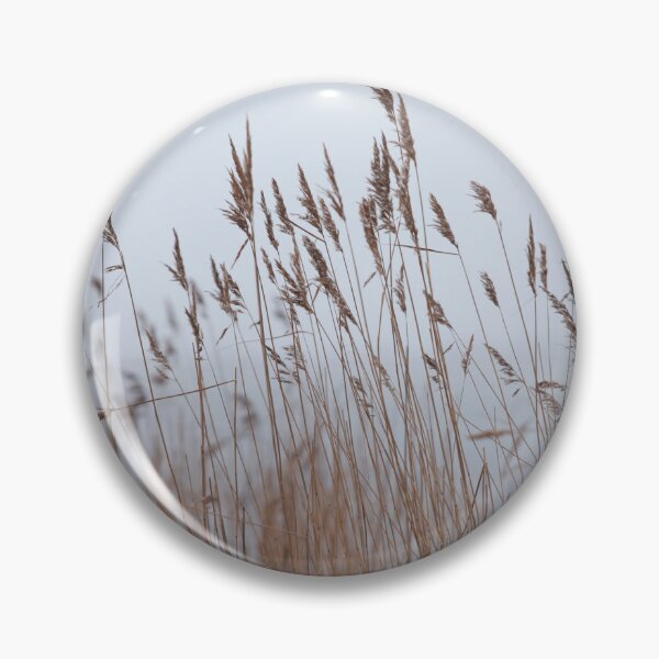 Item preview, beginning of winter it is snowing foreground panicles of dry reeds  designed and sold by mrivserg.