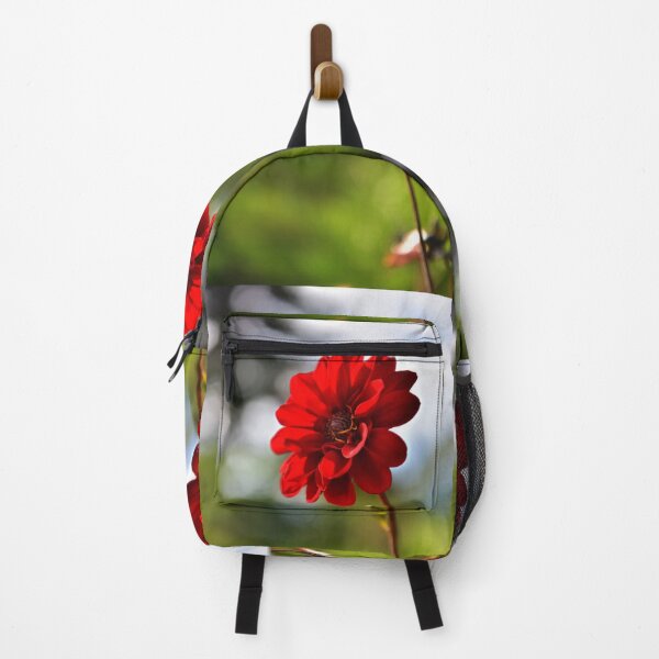 Item preview, Beautiful one red flower on blurred colourful background in the garden designed and sold by Borinna.