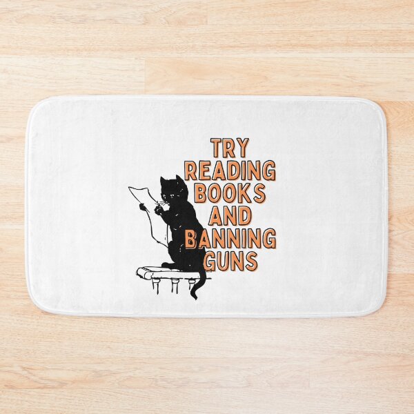 Item preview, reading books ban guns | try reading books and banning guns | cat reading designed and sold by wear4gamers.