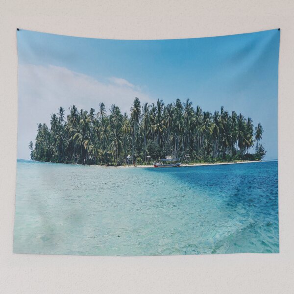 Item preview, Distant view of a boat moored at an island covered with tropical trees designed and sold by BestDesign87.