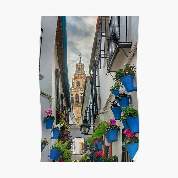 Narrow street and bell tower in Cordoba Poster