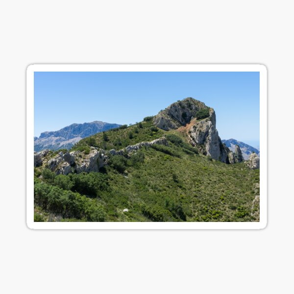 Ascent to the crest, green nature and blue sky in Spain Sticker