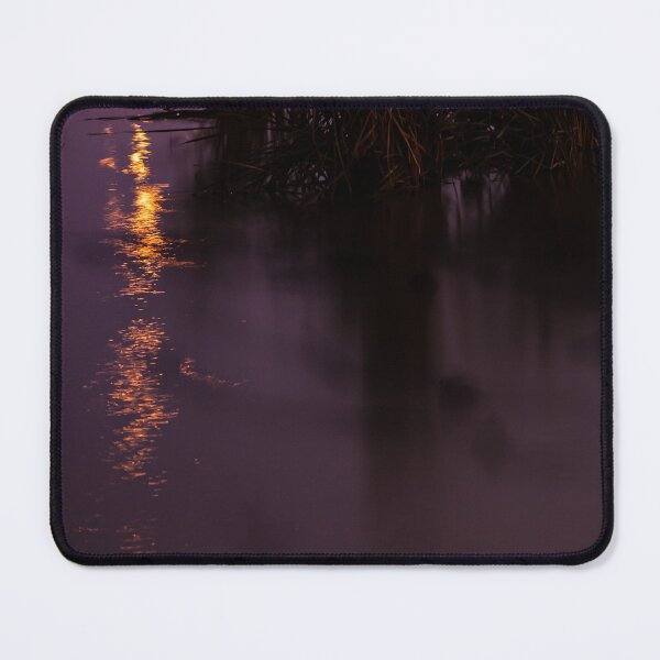 Item preview, Orange lights reflecting in the swampy grass filled river waters at night designed and sold by James-Cole.