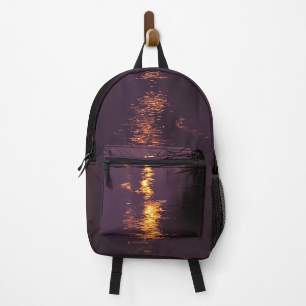 Item preview, Orange lights reflecting in the swampy grass filled river waters at night designed and sold by James-Cole.
