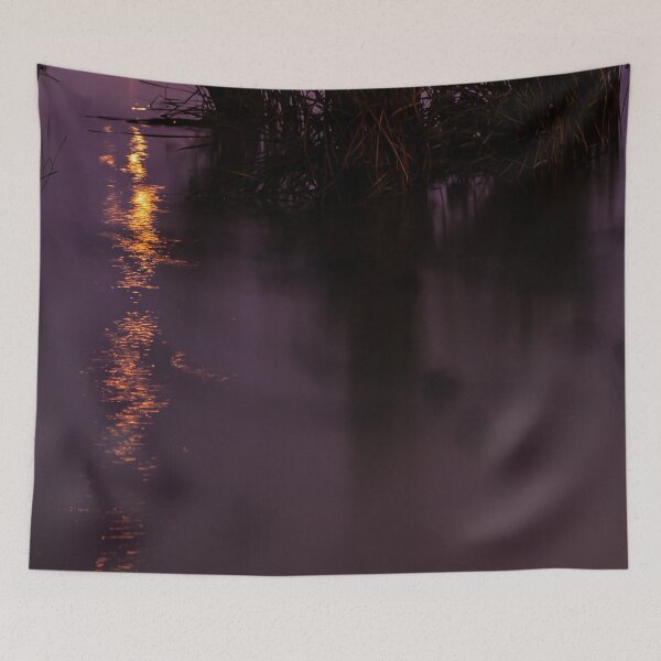 Item preview, Orange lights reflecting in the swampy grass filled river waters at night designed and sold by James-Cole.