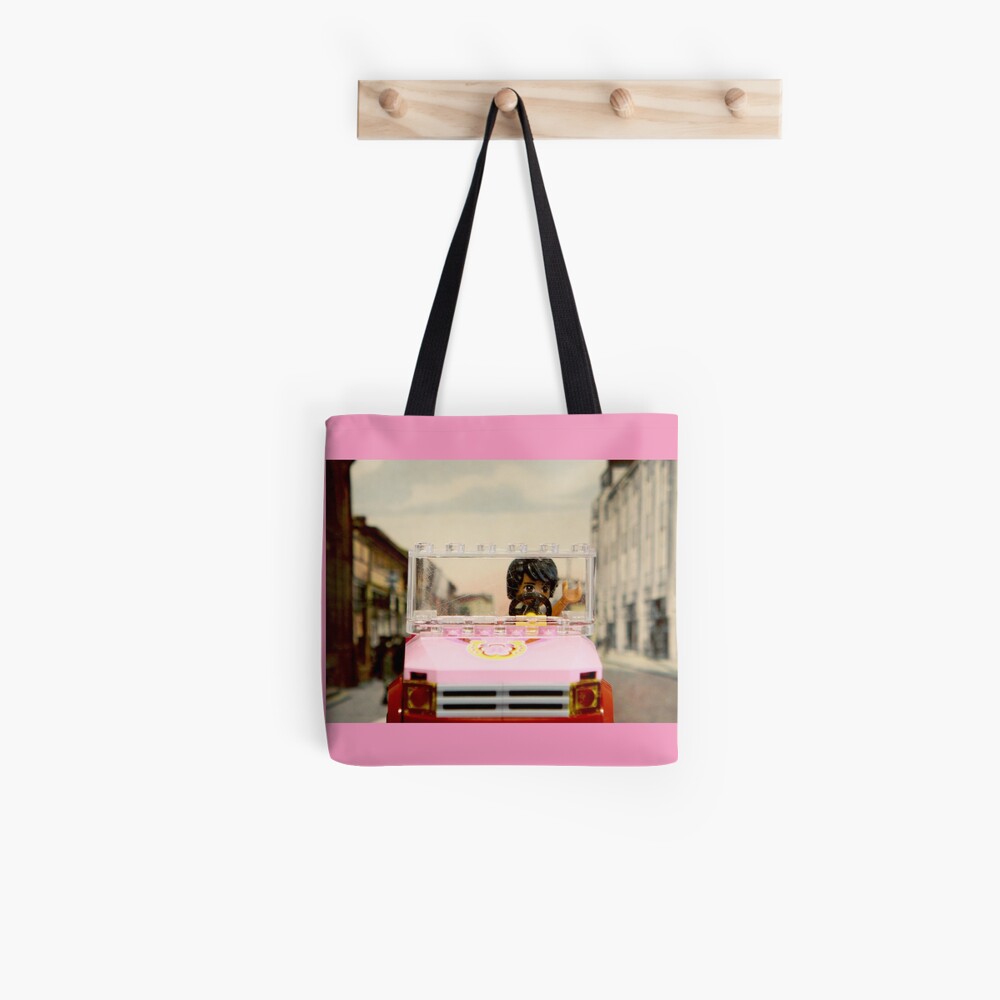 Legoman arrives to town streetscape Tote Bag