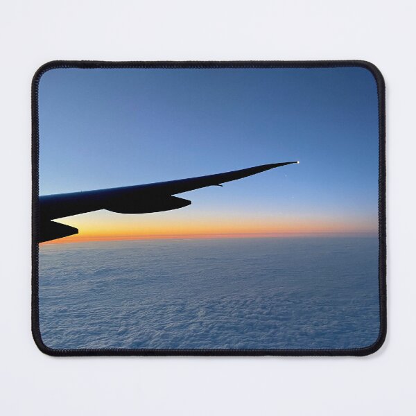 Item preview, Airplane wing silhouette with a orange blue sunset sky and clouds designed and sold by Dinashop.