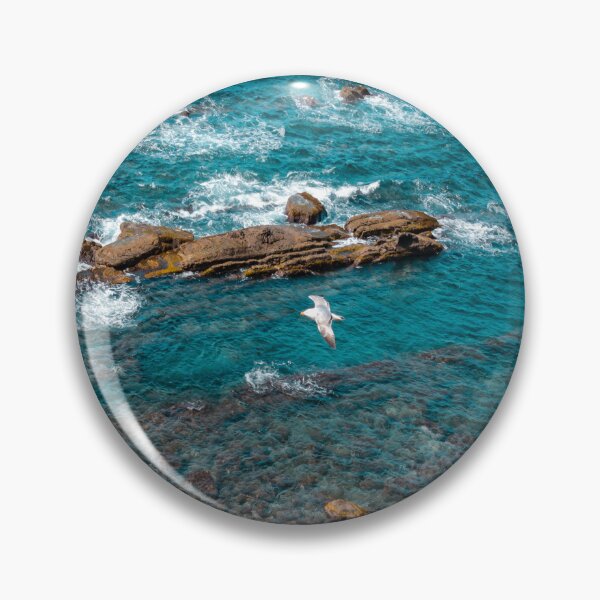 Item preview, Albatross above the blue ocean waves breaking by  rocks canal   Art Prints designed and sold by anisbbmbrush.