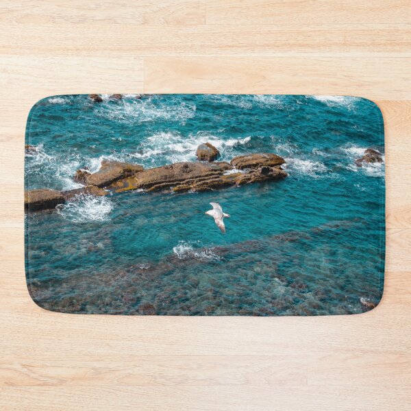 Item preview, Albatross above the blue ocean waves breaking by  rocks canal   Art Prints designed and sold by anisbbmbrush.