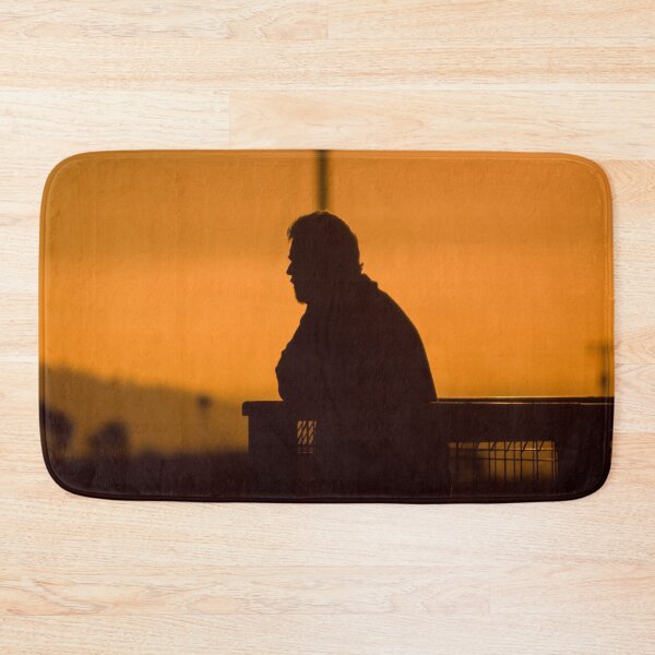 Item preview, Silhouette of man with beard at sunset leaning on fence looking out at view designed and sold by James-Cole.