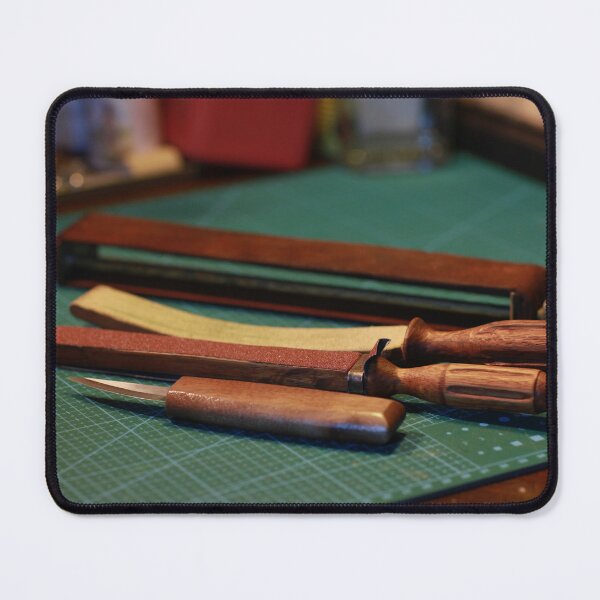 Item preview, wood cutter and a manual sharpening tool on a table designed and sold by mrivserg.