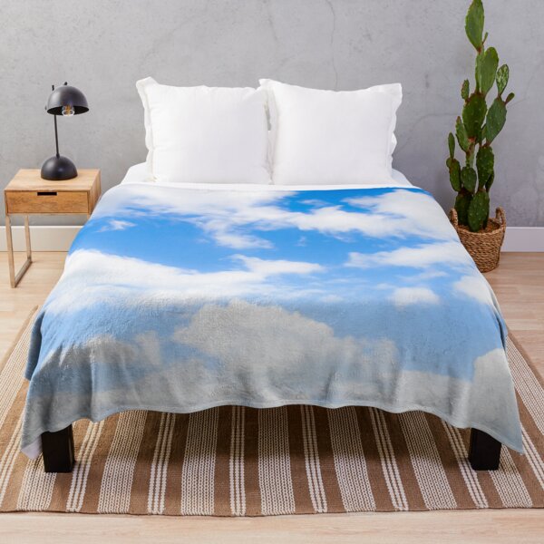 Item preview, Bright fluffy white clouds against a glowing blue sky designed and sold by James-Cole.