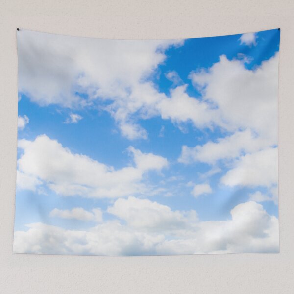 Item preview, Bright fluffy white clouds against a glowing blue sky designed and sold by James-Cole.