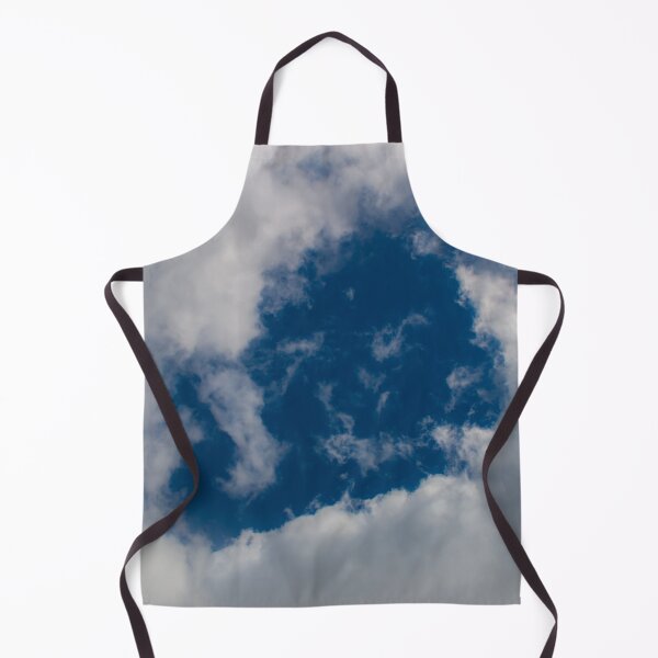 Item preview, A hole through thick fluffy white clouds showing the deep blue sky behind designed and sold by James-Cole.