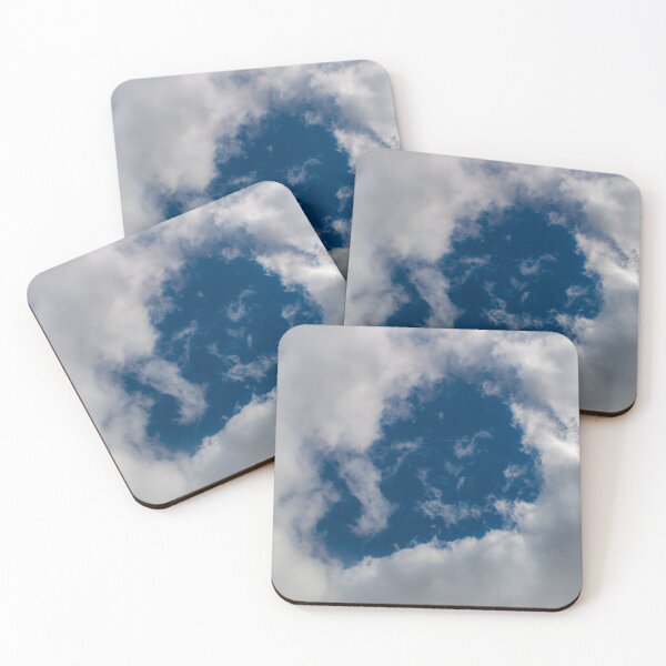 Item preview, A hole through thick fluffy white clouds showing the deep blue sky behind designed and sold by James-Cole.