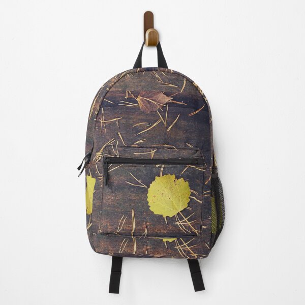 Item preview, Pine needles and a yellow leaf on a wooden board designed and sold by riku05830.