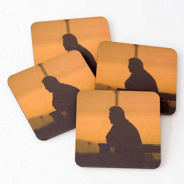 Item preview, Silhouette of man with beard at sunset leaning on fence looking out at view designed and sold by James-Cole.