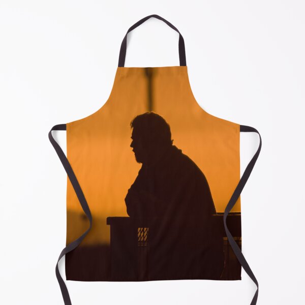 Item preview, Silhouette of man with beard at sunset leaning on fence looking out at view designed and sold by James-Cole.