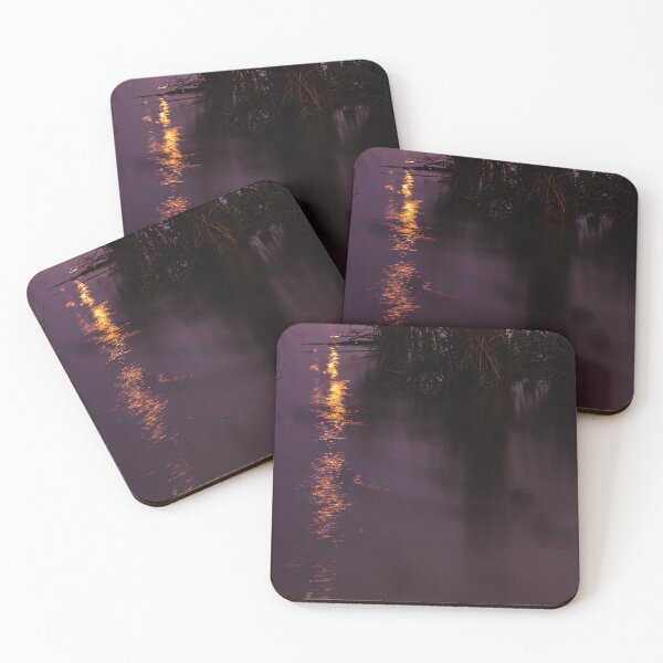 Item preview, Orange lights reflecting in the swampy grass filled river waters at night designed and sold by James-Cole.