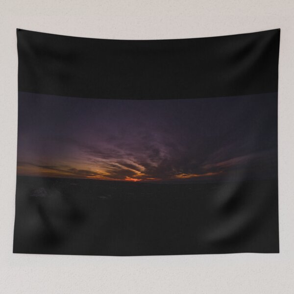 Item preview, Dark wispy clouds in a deep purple sky in the afterglow of an orange sunset aerial panoramic designed and sold by James-Cole.