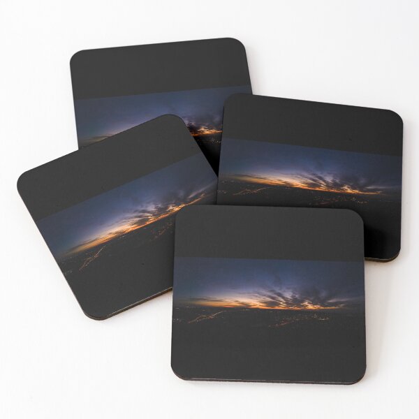 Item preview, Dark wispy clouds in a deep blue sky in the afterglow of an golden sunset above the street lights aerial panoramic designed and sold by James-Cole.