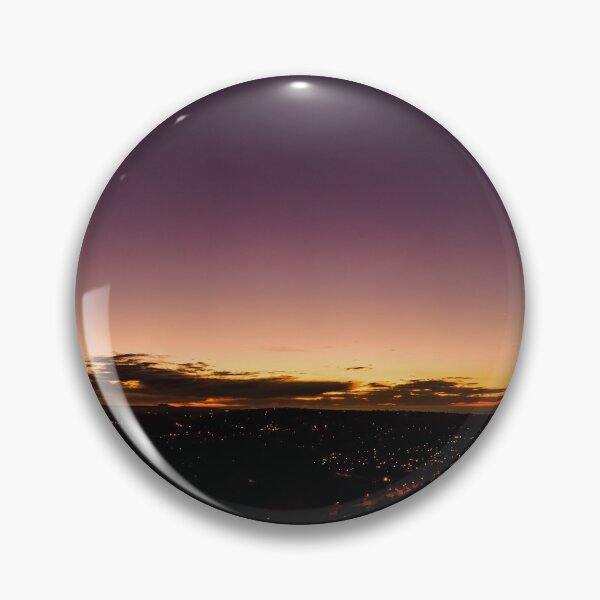 Item preview, Dark horizon clouds in a deep purple sky in the afterglow of an golden sunset above the street lights aerial panoramic designed and sold by James-Cole.