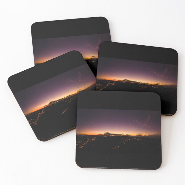 Item preview, Dark horizon clouds in a deep purple sky in the afterglow of an golden sunset above the street lights aerial panoramic designed and sold by James-Cole.