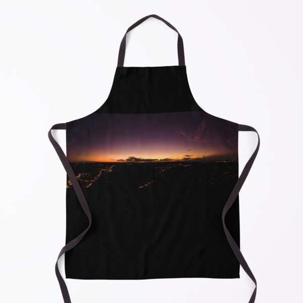 Item preview, Dark horizon clouds in a deep purple sky in the afterglow of an golden sunset above the street lights aerial panoramic designed and sold by James-Cole.